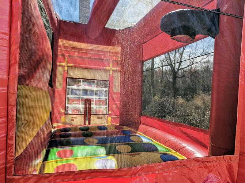 fire station bounce house with basketball hoop